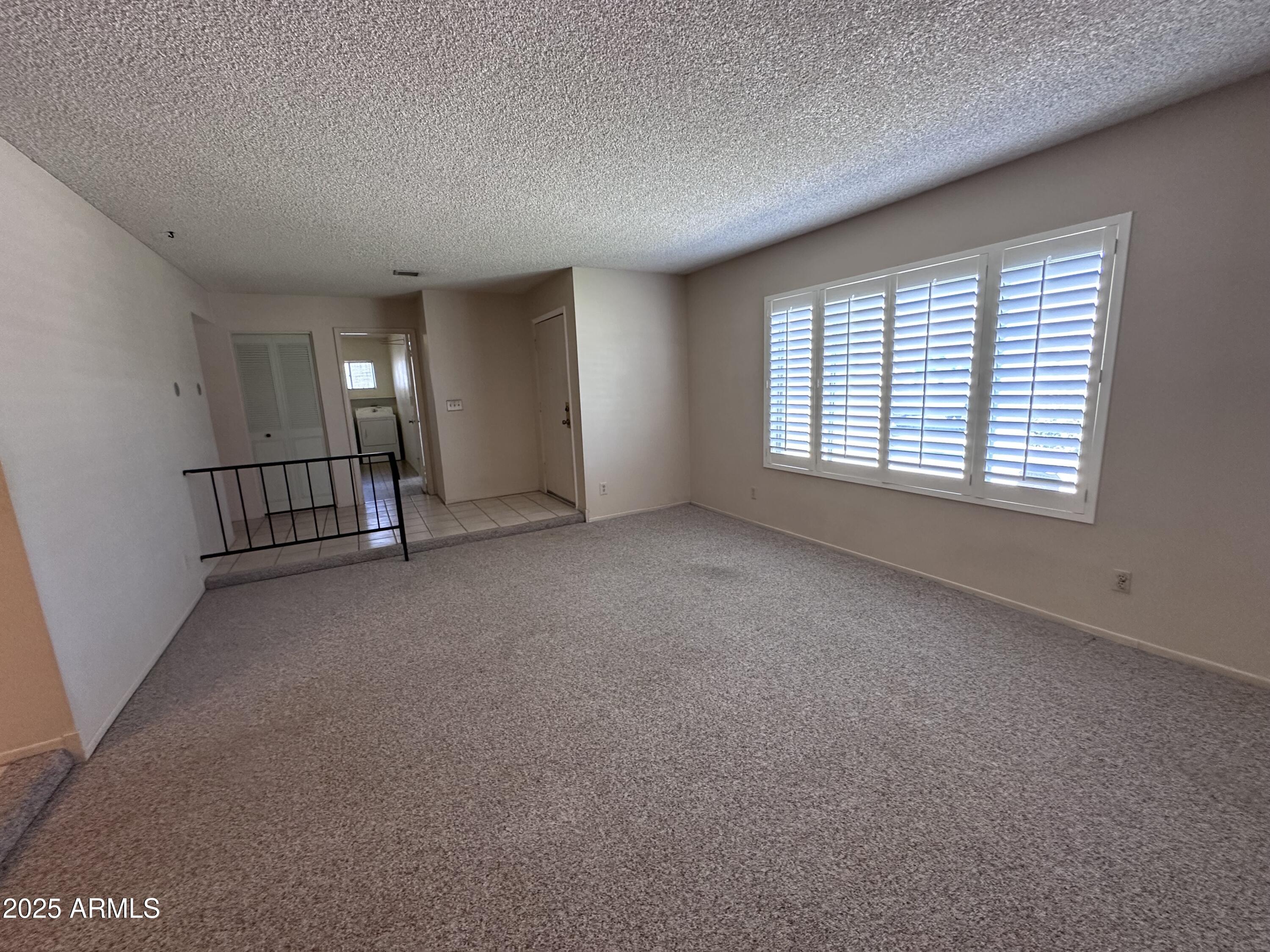 5507 West Hearn Road Glendale, AZ 85306 - Photo 5 of 19 a view of a livingroom with a staircase