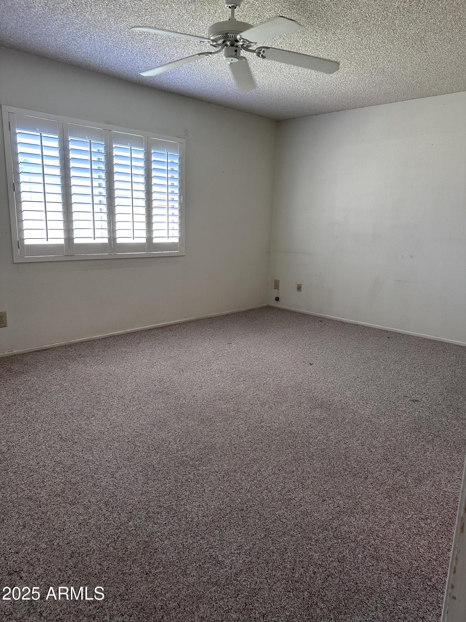 5507 West Hearn Road Glendale, AZ 85306 - Photo 10 of 19 an empty room with a window