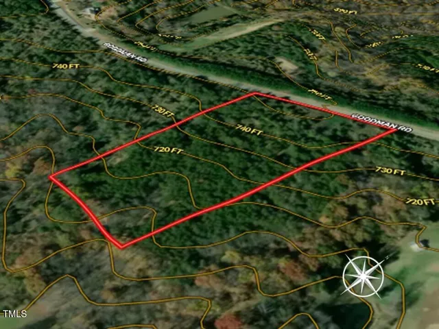 a view of a dry yard with lots of bushes