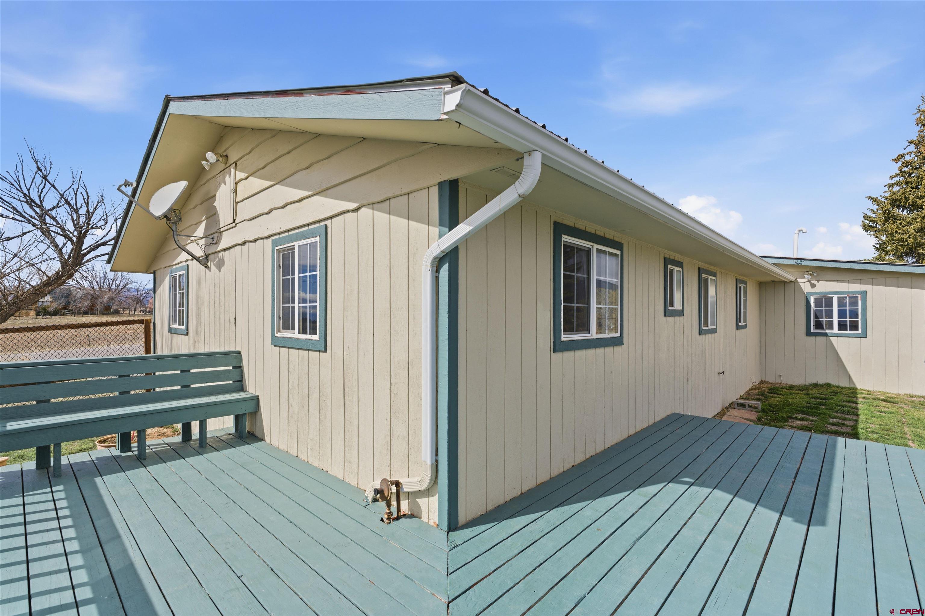 16216 2600th Road Cedaredge, CO 81413 - Photo 31 of 45 a view of a house with wooden deck