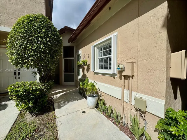 a kitchen with a refrigerator and cabinets