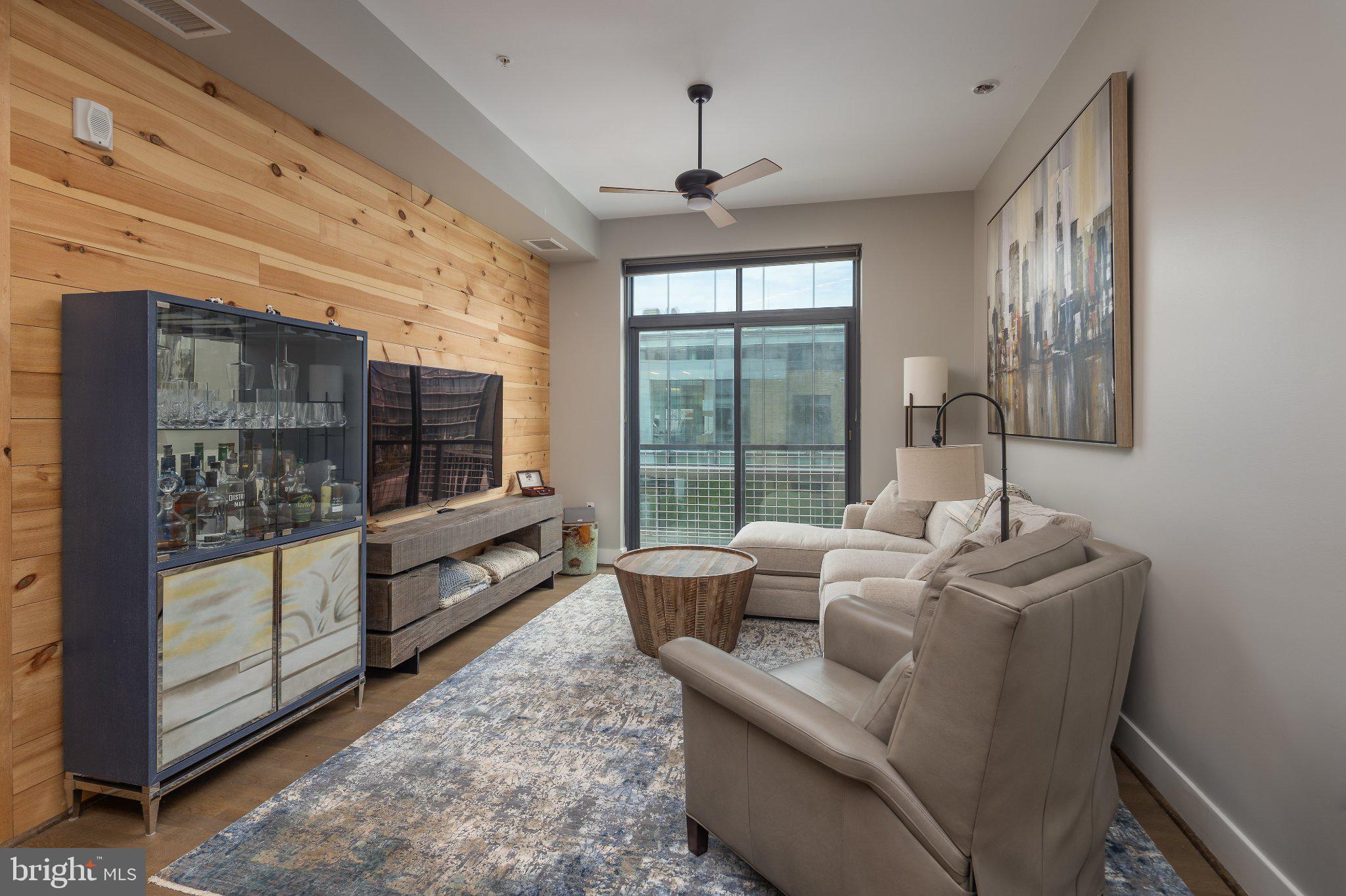 525 Southwest Water Street Southwest, Unit 404 Washington, DC 20024 - Photo 6 of 82 a living room with furniture and a floor to ceiling window