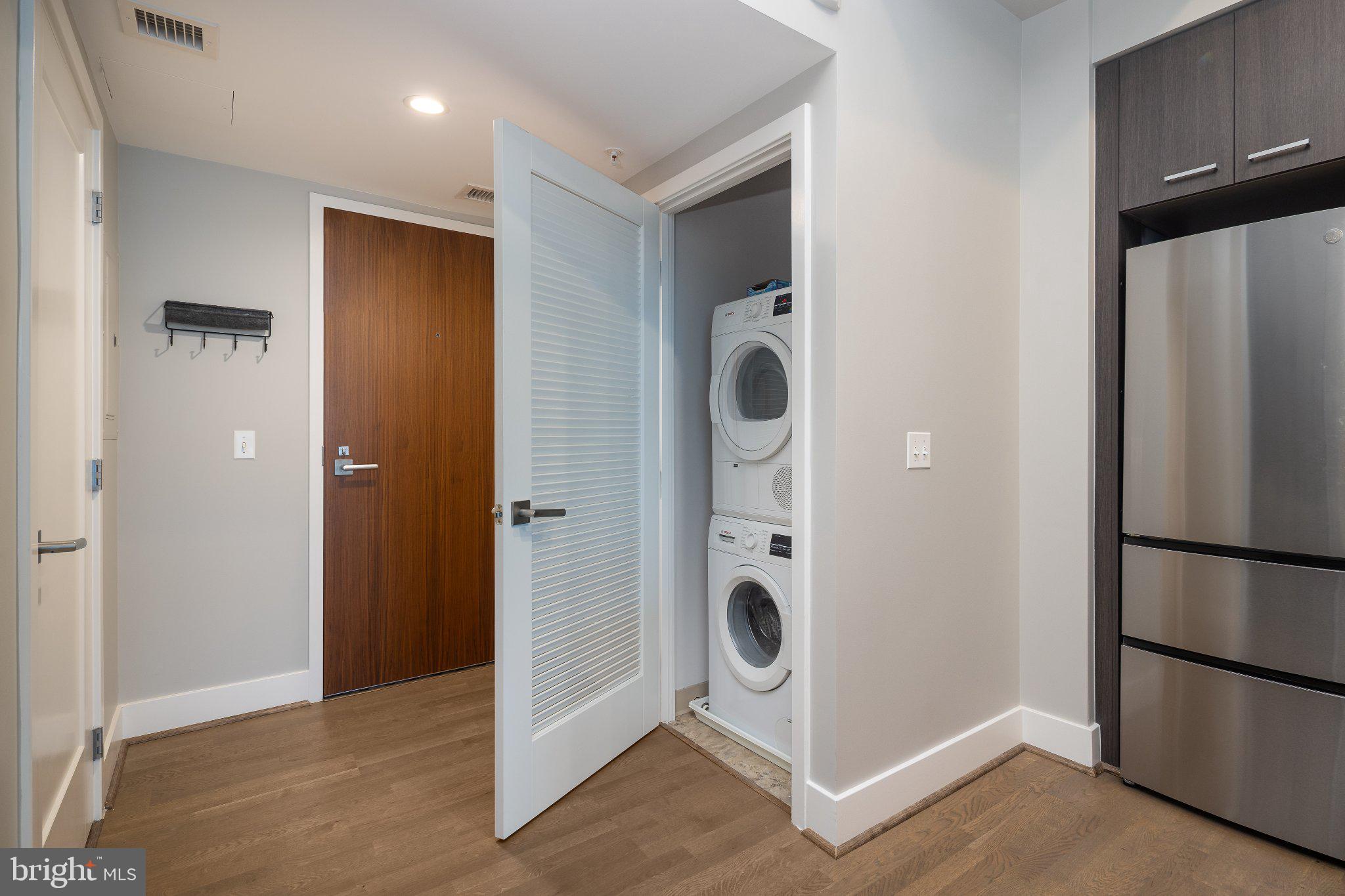 525 Southwest Water Street Southwest, Unit 404 Washington, DC 20024 - Photo 10 of 82 a view of a storage and utility room with washer and dryer