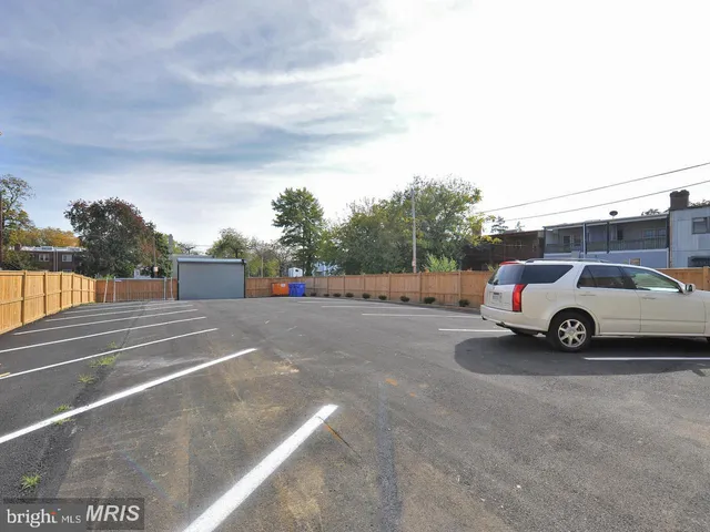a view of street with parked cars