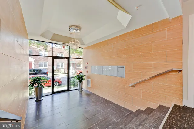a view of an entryway with wooden floor