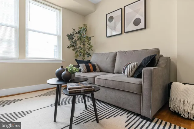a living room with furniture and a window