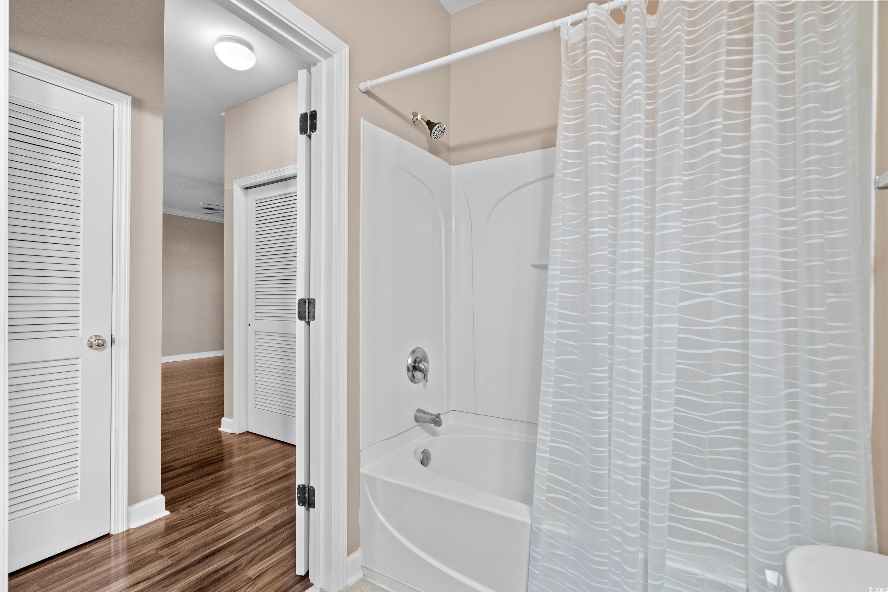 336 Kiskadee Loop, Unit B Conway, SC 29526 - Photo 30 of 40 Bathroom with hardwood / wood-style floors and shower / bath combo