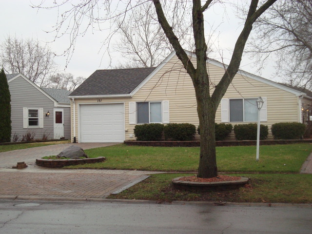 151 Heathgate Road Montgomery, IL 60538 - Photo 1 of 23 a front view of a house with garden