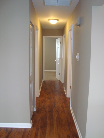 151 Heathgate Road Montgomery, IL 60538 - Photo 13 of 23 a view of a hallway with wooden floor