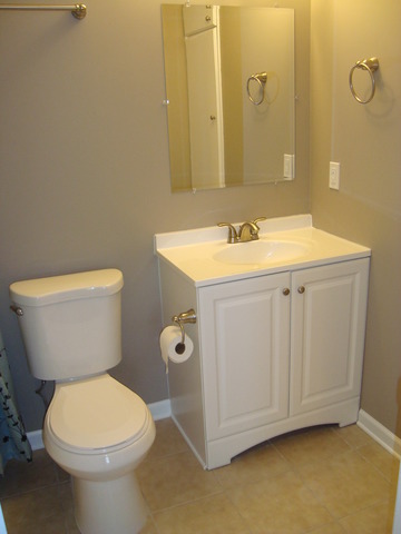 151 Heathgate Road Montgomery, IL 60538 - Photo 18 of 23 a bathroom with a sink a toilet and a mirror