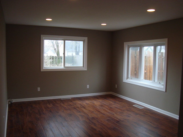 151 Heathgate Road Montgomery, IL 60538 - Photo 4 of 23 a view of an empty room with wooden floor and a window
