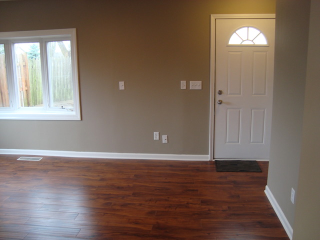 151 Heathgate Road Montgomery, IL 60538 - Photo 5 of 23 an empty room with wooden floor and windows