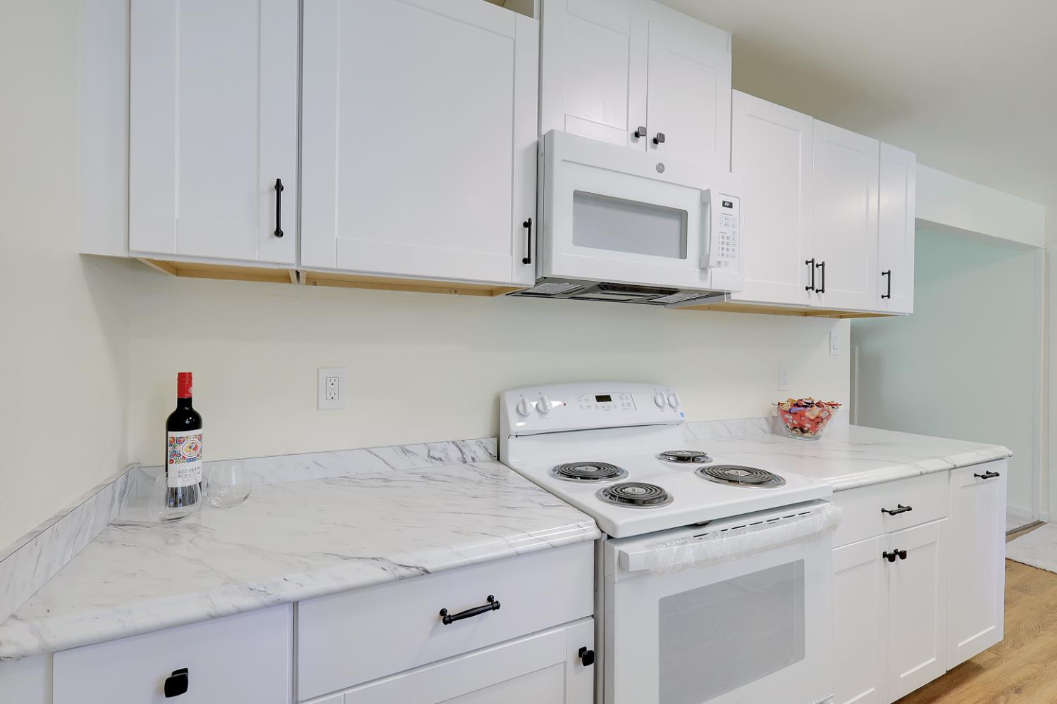 10673 Alta Street Grass Valley, CA 95945 - Photo 12 of 38 a view of cabinets with washer and dryer