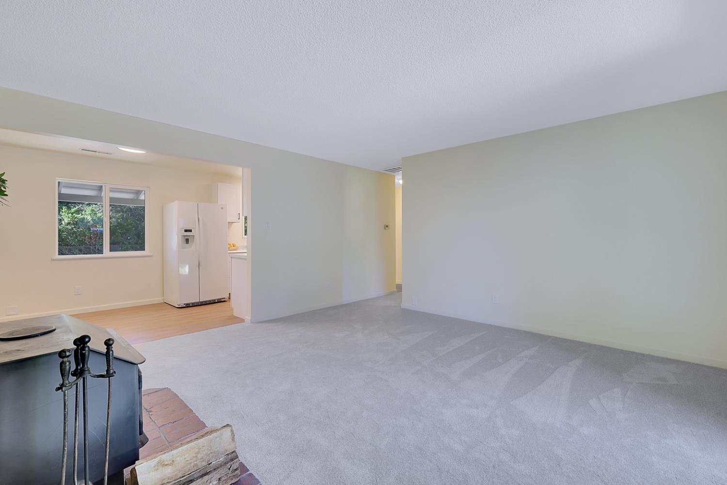 10673 Alta Street Grass Valley, CA 95945 - Photo 17 of 38 a view of an empty room with wooden floor