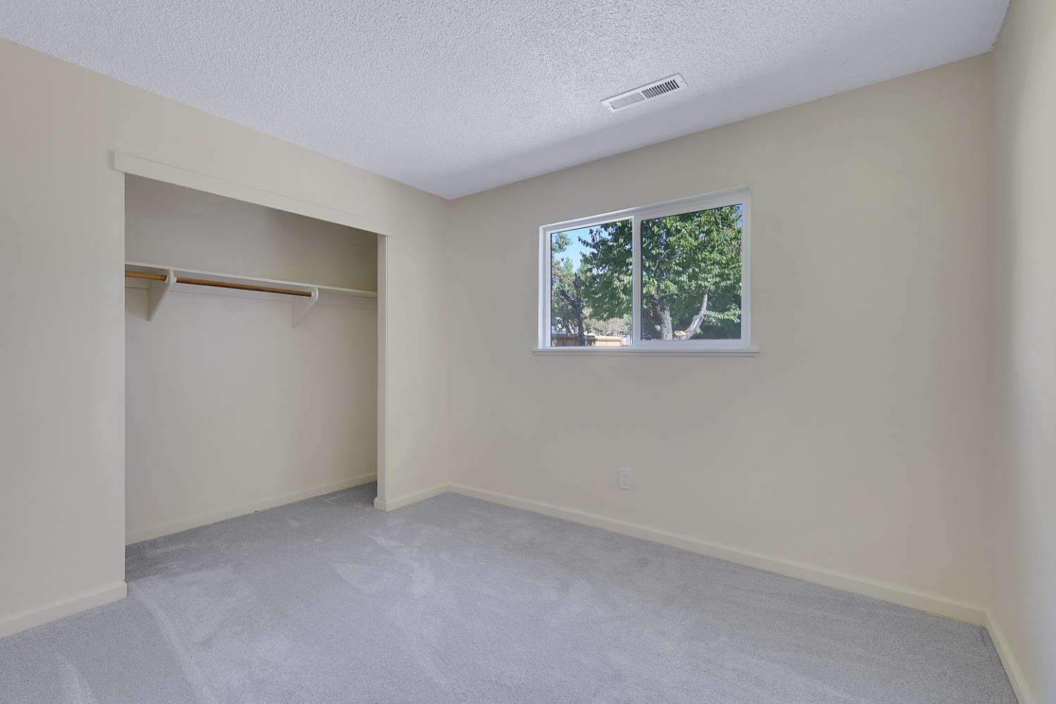 10673 Alta Street Grass Valley, CA 95945 - Photo 19 of 38 a view of an empty room with a window