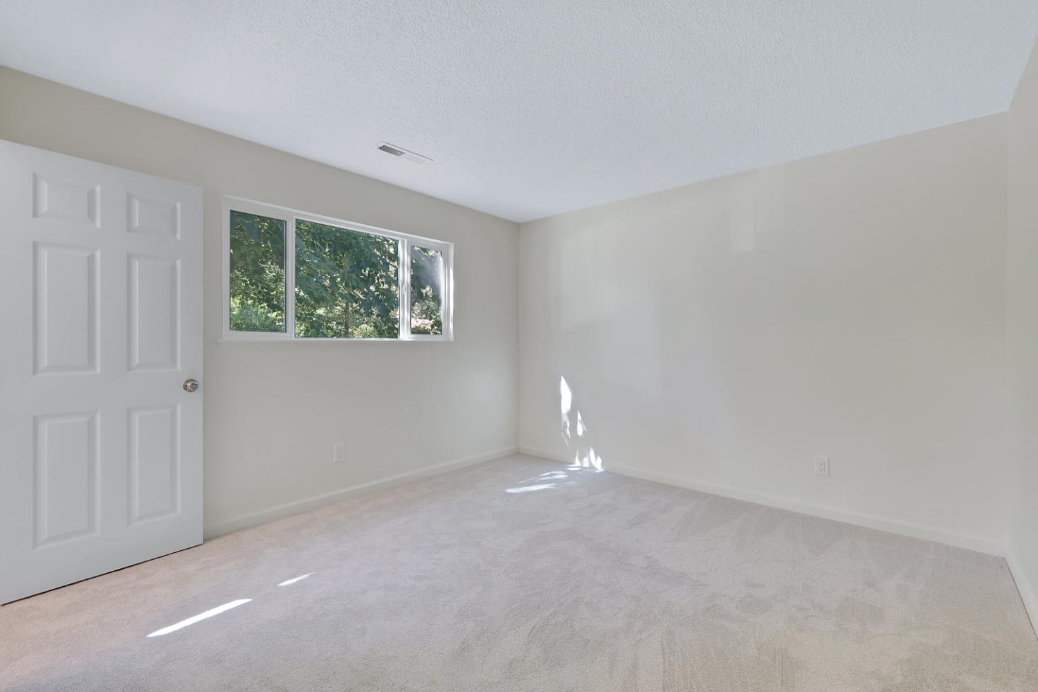 10673 Alta Street Grass Valley, CA 95945 - Photo 23 of 38 an empty room with windows