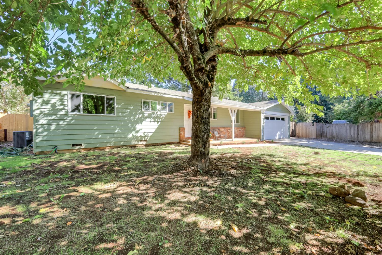 10673 Alta Street Grass Valley, CA 95945 - Photo 6 of 38 a house with trees in the background