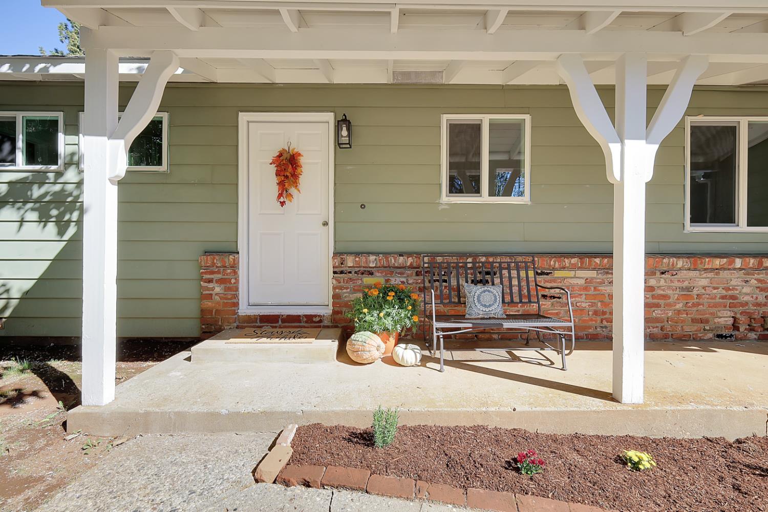 10673 Alta Street Grass Valley, CA 95945 - Photo 7 of 38 a front view of a house with a yard