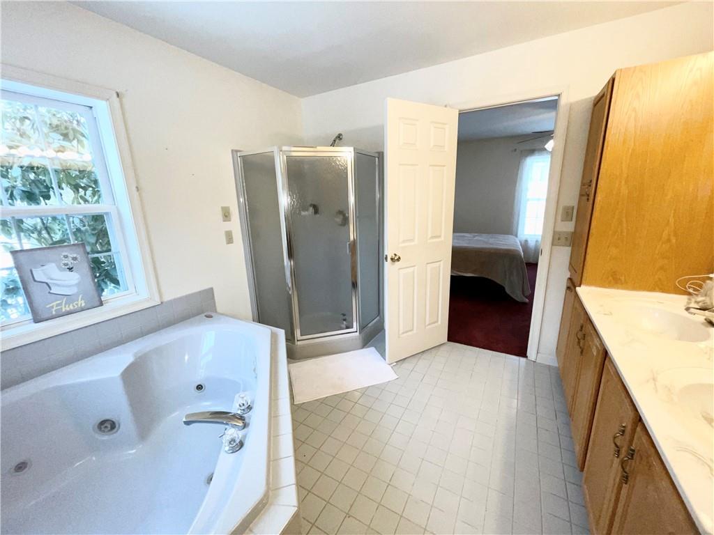 211 Fox Hollow Road Dayton, PA 16222 - Photo 14 of 25 a bathroom with a tub sink and mirror