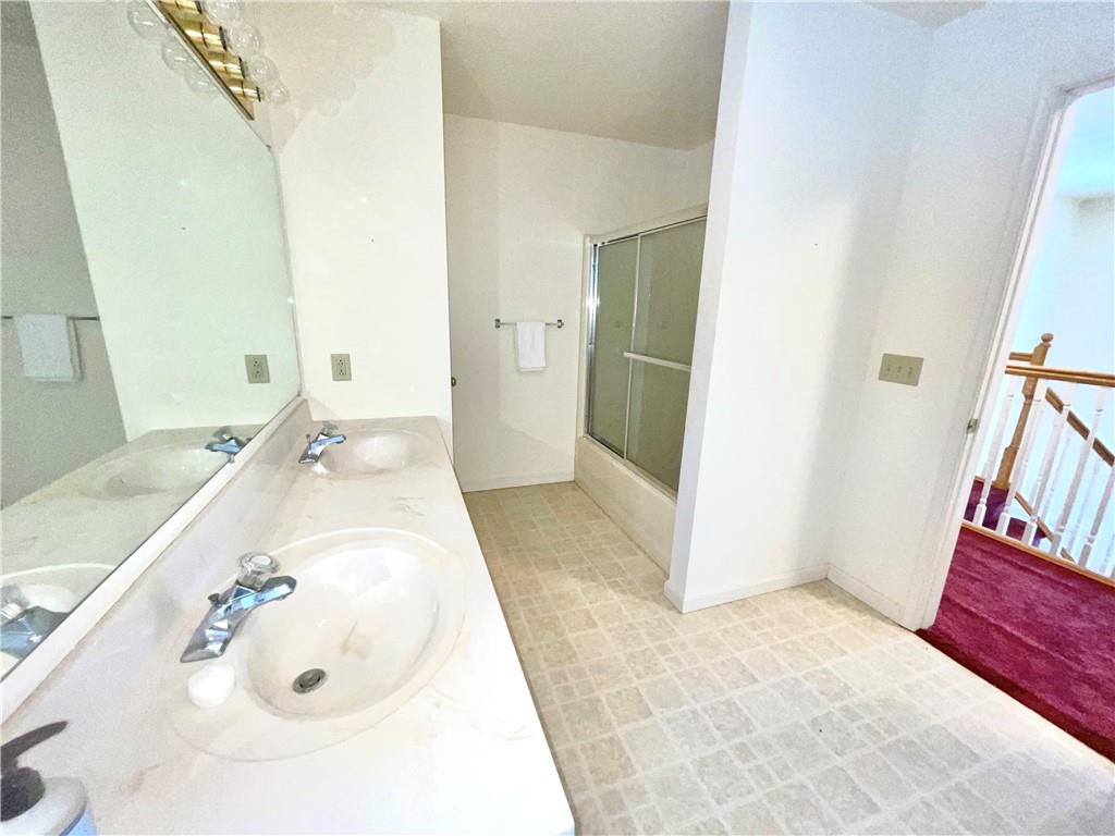 211 Fox Hollow Road Dayton, PA 16222 - Photo 19 of 25 a spacious bathroom with a tub sink and a mirror