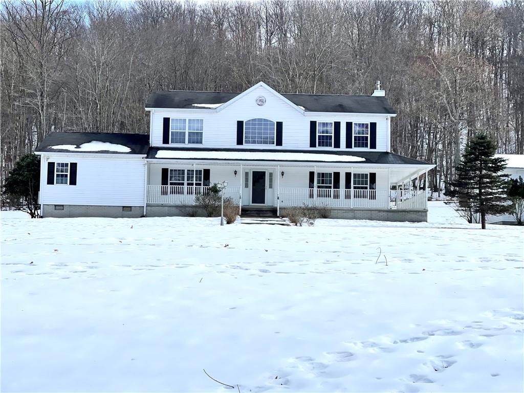 211 Fox Hollow Road Dayton, PA 16222 - Photo 2 of 25 a view of a white house with a yard covered in snow