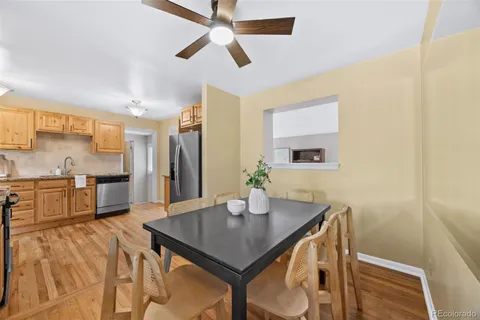 a kitchen with a table chairs and microwave