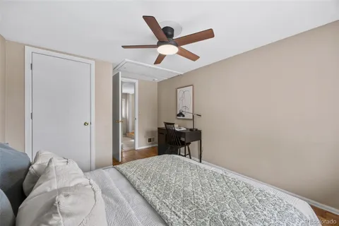a bedroom with a bed and a table