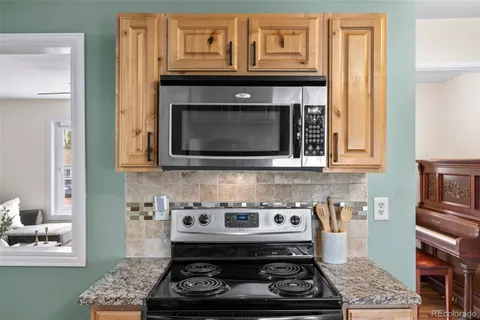 a kitchen with a stove and a microwave