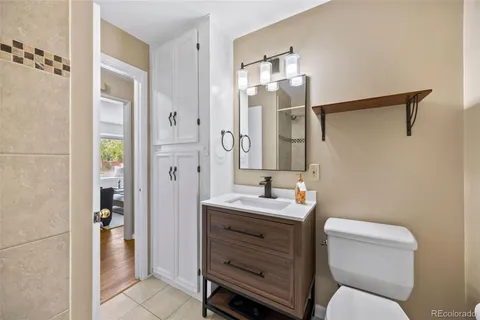 a bathroom with a toilet sink and shower