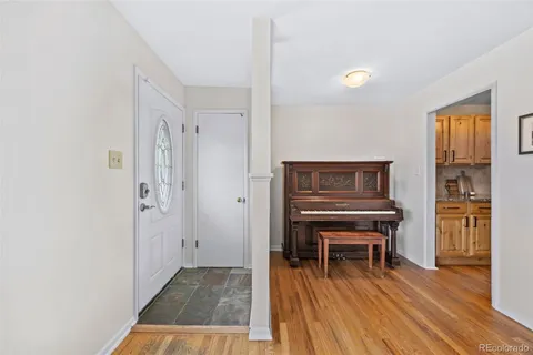 a room with furniture and a wooden floor