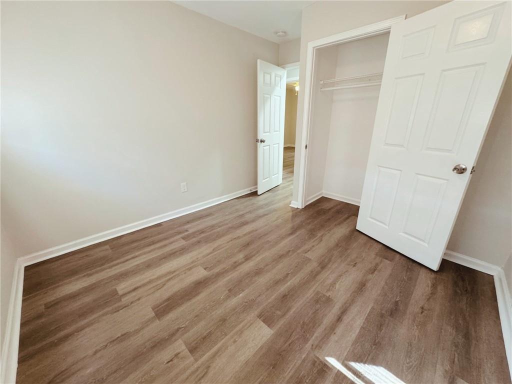 2933 Port Royal Lane Decatur, GA 30034 - Photo 6 of 12 an empty room with wooden floor