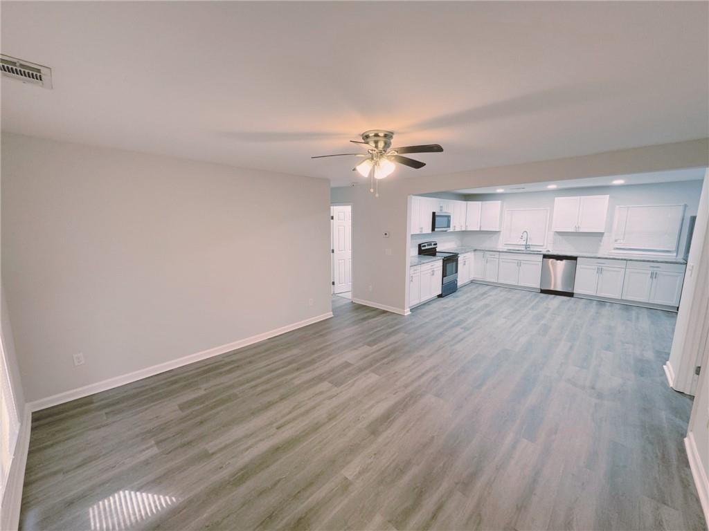 2933 Port Royal Lane Decatur, GA 30034 - Photo 9 of 12 a view of a kitchen with a dishwasher cabinets and wooden floor