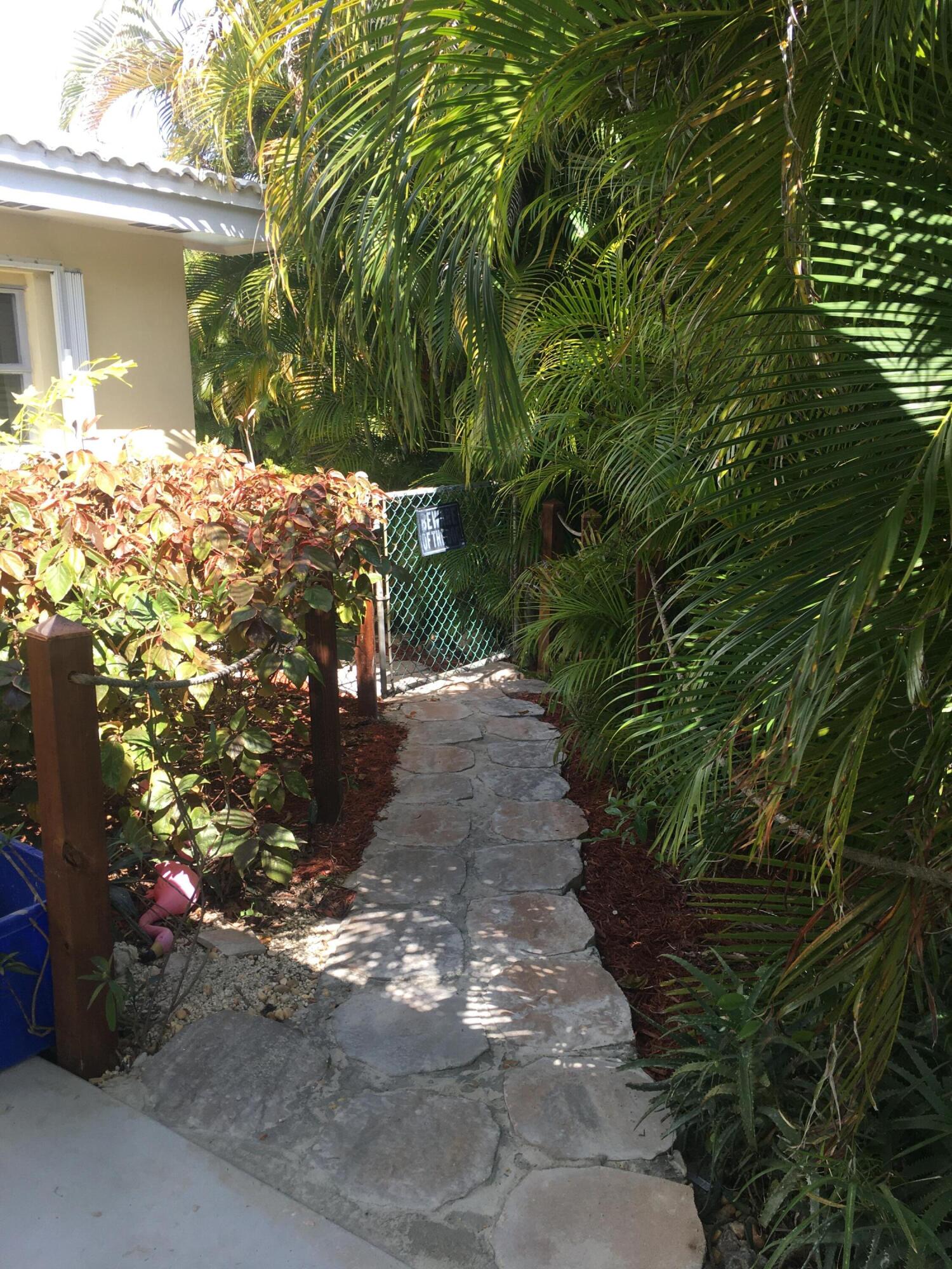 325 Inlet Way Palm Beach Shores, FL 33404 - Photo 7 of 30 side walkway to pool