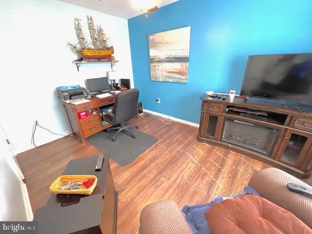 a bedroom with a bed couch and a window