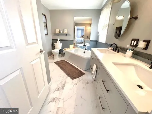 a bathroom with a shower and a mirror