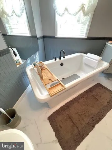 a view of a house with swimming pool in front of it