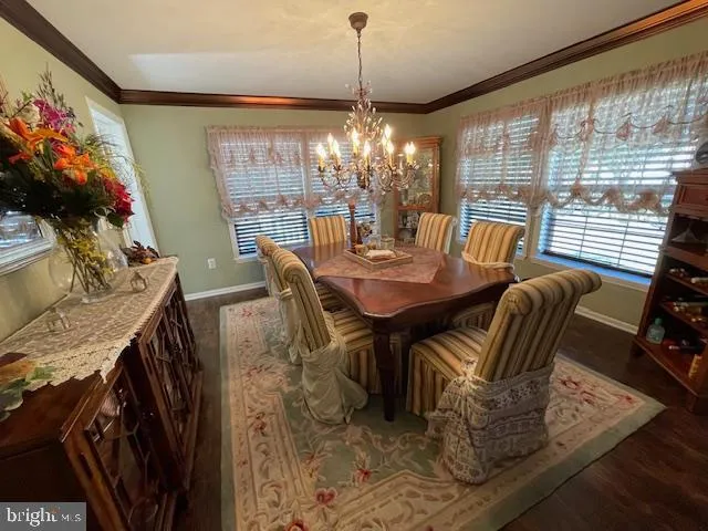 a work room with furniture and a window