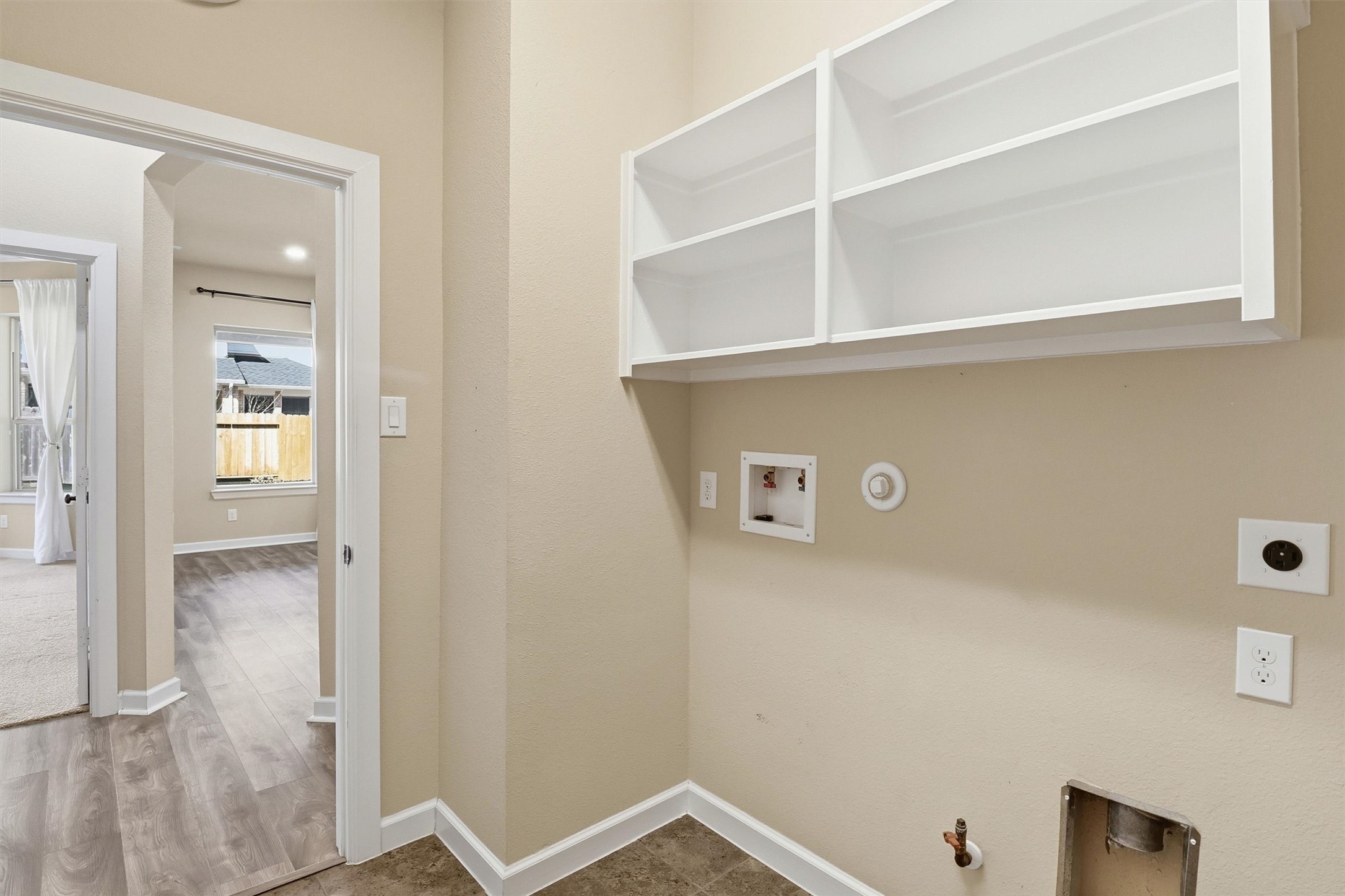 26202 Rustic Ranch Lane Katy, TX 77494 - Photo 20 of 50 The large laundry room is conveniently located by the primary suite.