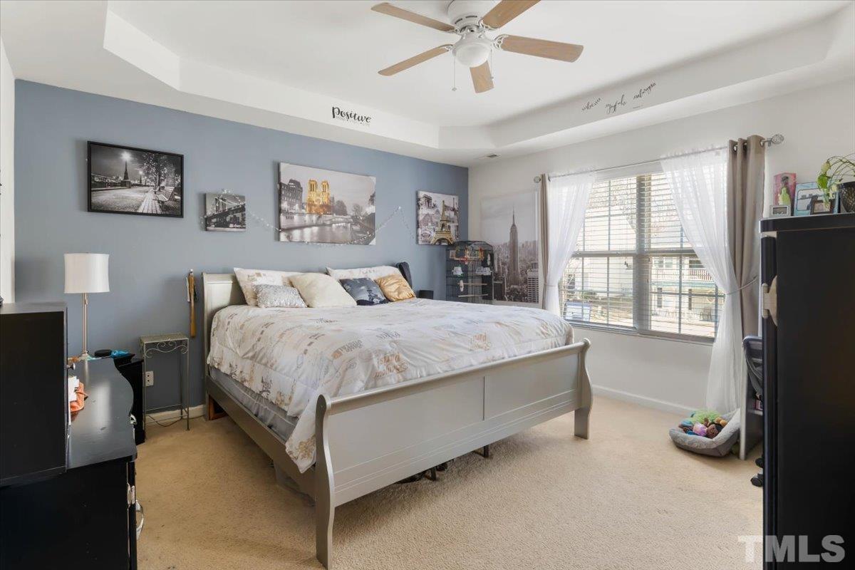 4262 Dalcross Road Raleigh, NC 27610 - Photo 15 of 27 a spacious bedroom with a bed and a large window