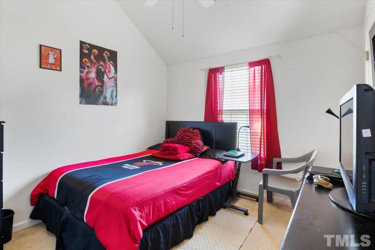 4262 Dalcross Road Raleigh, NC 27610 - Photo 20 of 27 a bedroom with a bed and a window