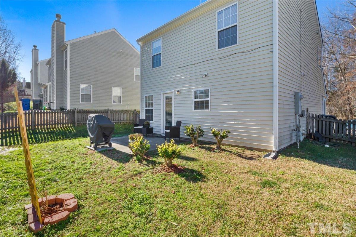 4262 Dalcross Road Raleigh, NC 27610 - Photo 23 of 27 a view of backyard of house with outdoor seating