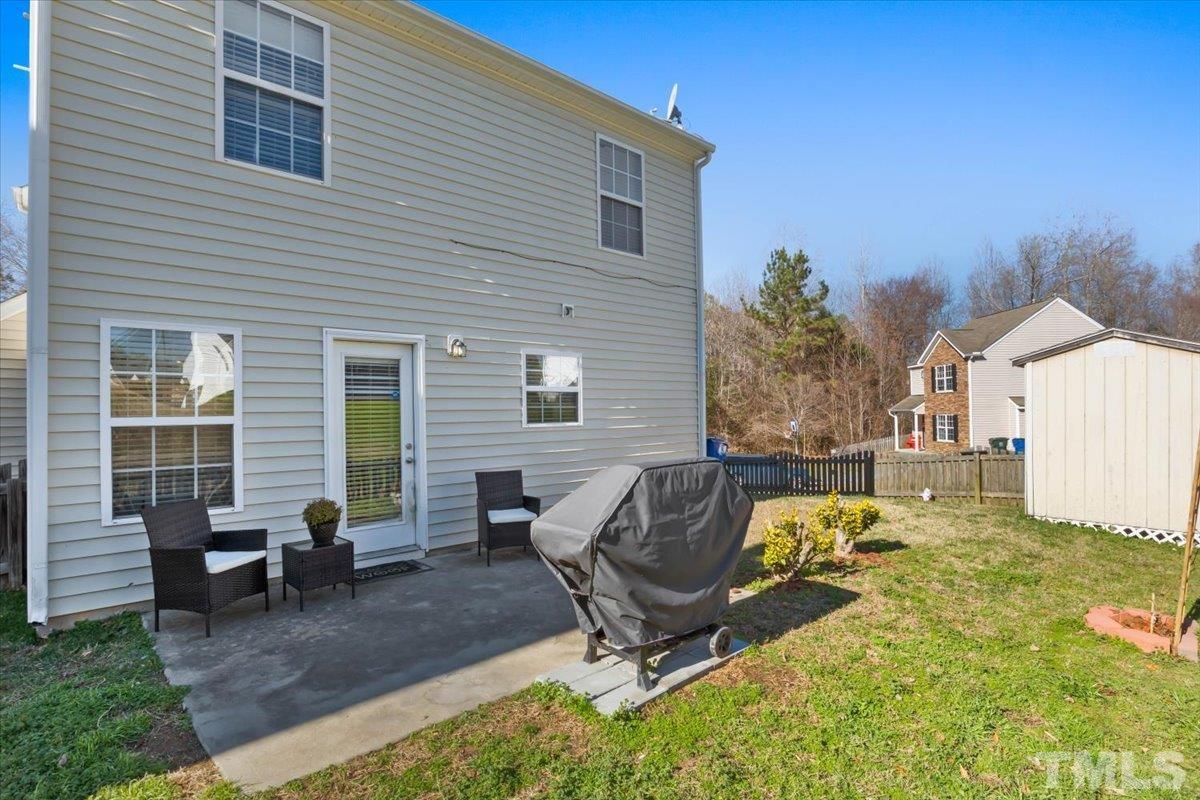 4262 Dalcross Road Raleigh, NC 27610 - Photo 24 of 27 a view of a house with backyard porch and sitting area