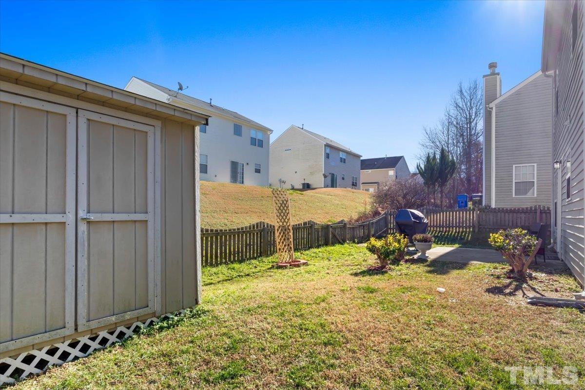 4262 Dalcross Road Raleigh, NC 27610 - Photo 25 of 27 a view of a house with a yard