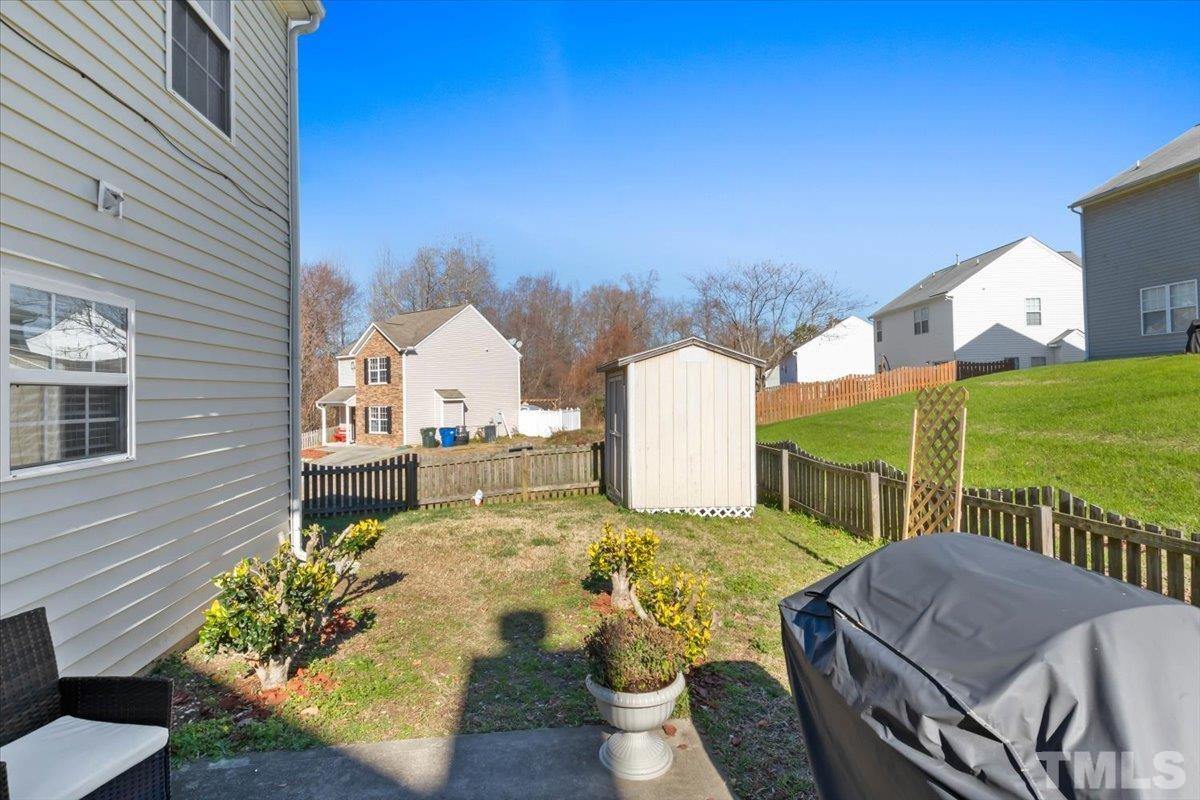 4262 Dalcross Road Raleigh, NC 27610 - Photo 26 of 27 a view of a patio with couches table and chairs and potted plants