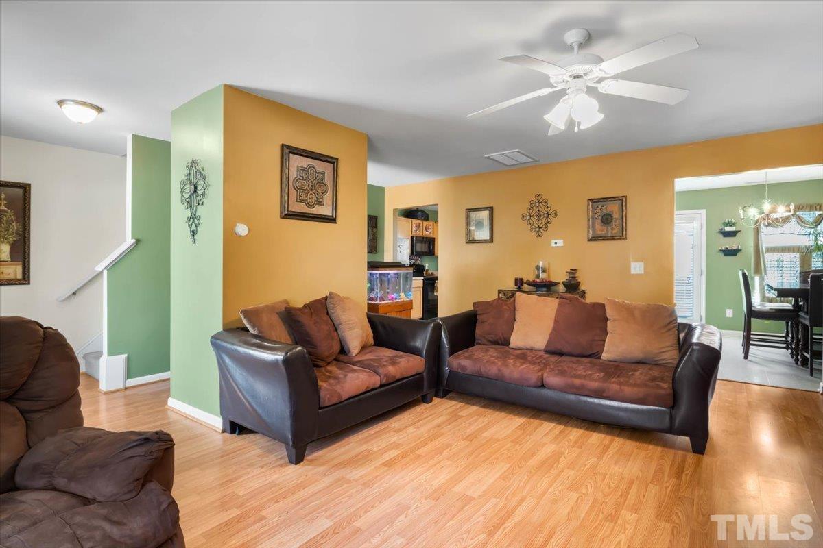 4262 Dalcross Road Raleigh, NC 27610 - Photo 6 of 27 a living room with furniture and a large window