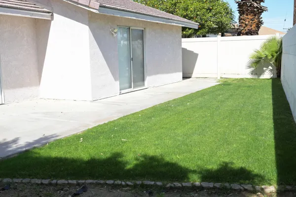 a view of backyard with small cabin