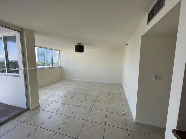 a view of an empty room and window