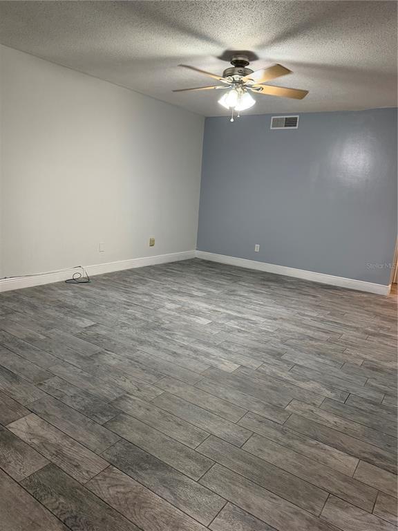 7409 Abonado Road, Unit 7409 Tampa, FL 33615 - Photo 15 of 25 wooden floor in an empty room
