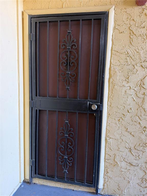 7409 Abonado Road, Unit 7409 Tampa, FL 33615 - Photo 2 of 25 a door with wooden wall