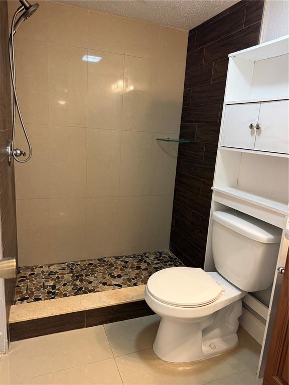 7409 Abonado Road, Unit 7409 Tampa, FL 33615 - Photo 24 of 25 a white toilet sitting next to a bathroom sink